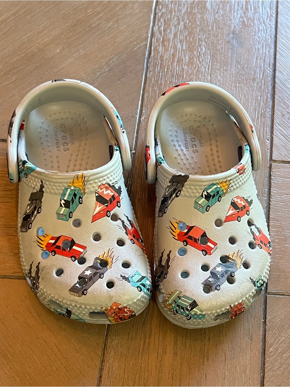 CROCS Kids Beige Slip-On Clogs with Colorful Racing Car Print